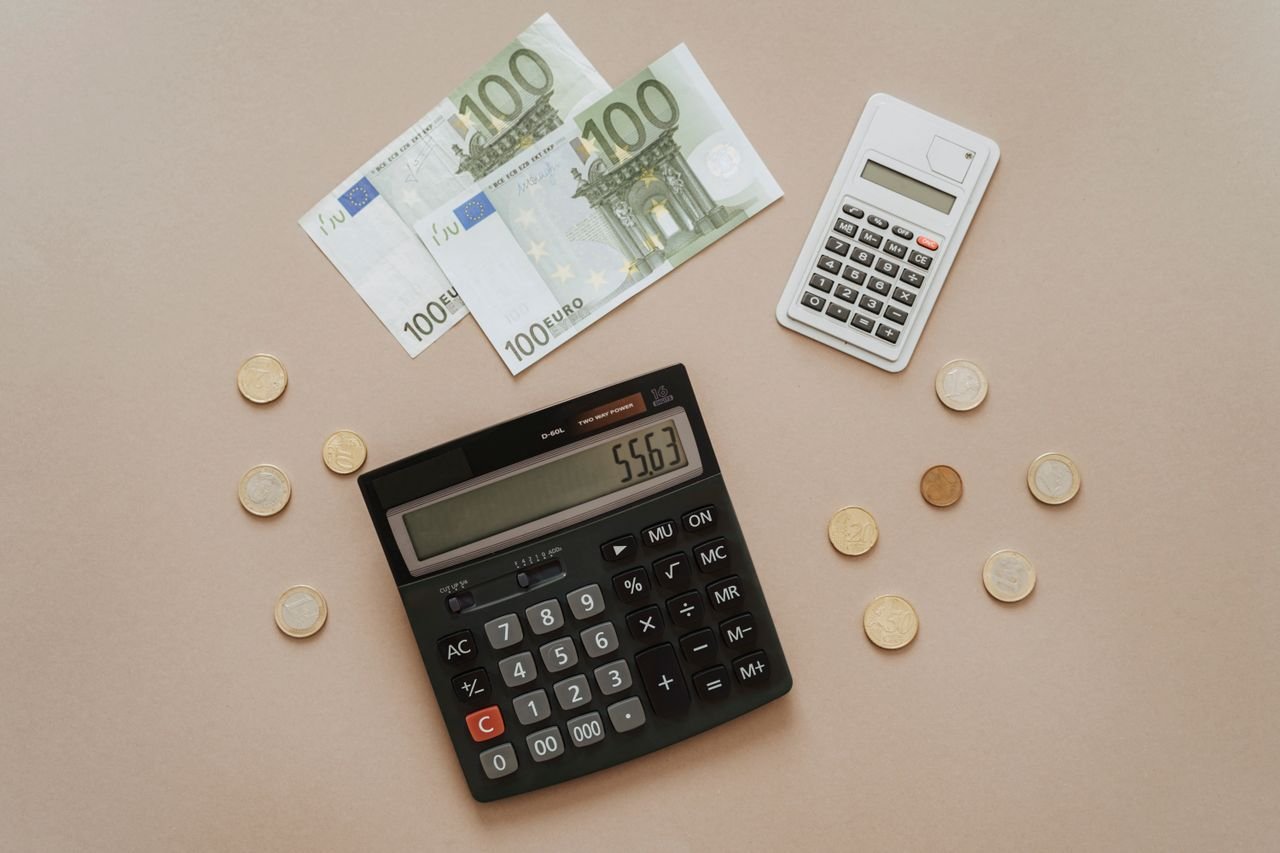 Calculators and currency representing the financial analysis a fractional CFO provides