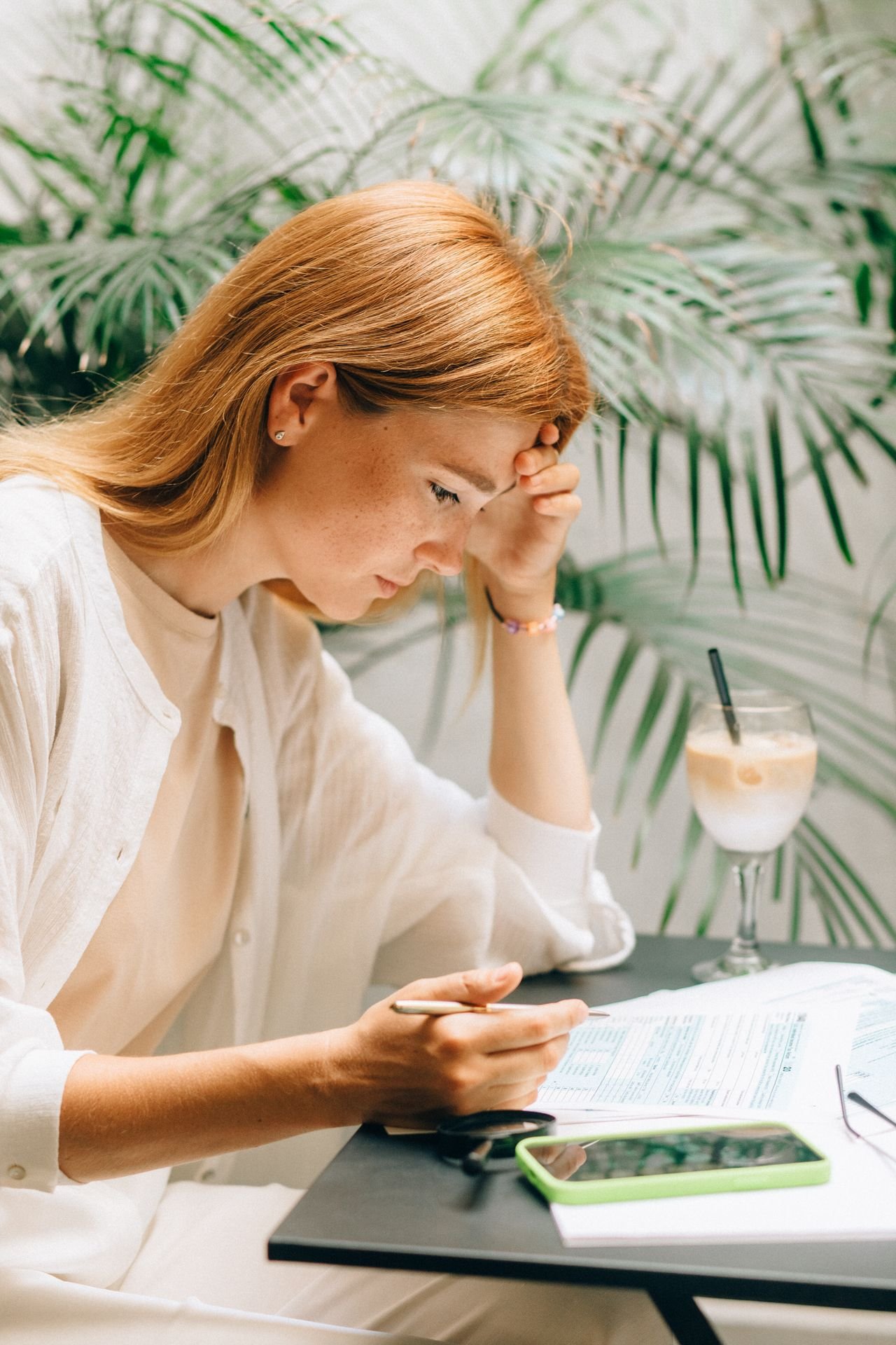 Business owner carefully reviewing documents after receiving a CRA letter or audit notice